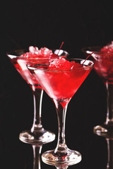 Strawberry daiquiri cocktail with lime, strawberry, cherry and mint