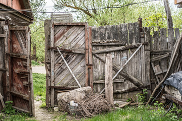 Old decaying wooden gate in the village