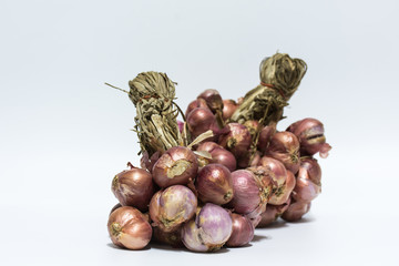 Group of red onion on white background,selective focus.
