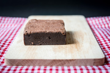 Chocolate Brownie cake on a dark plate