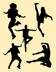 Happy young dancers silhouettes. Good use for symbol, logo, web icon, mascot, sign, or any design yo want.