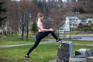 A woman do exercises outdoor with dumbbells	