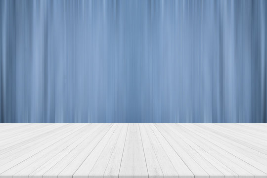 Empty white wooden table with blue blurred background,Free space for product editing