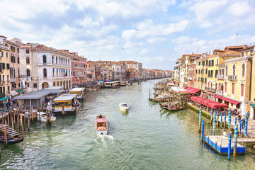 Fototapeta na wymiar Boats at Grand Canal in Venice. Scenice Italian Lagoon