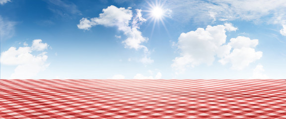 Red checkered tablecloth with summer sky