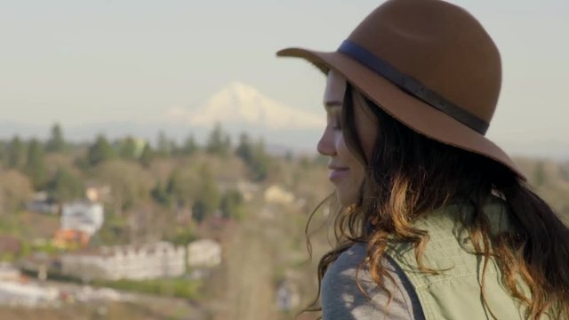 Young Woman Looks Around At View, Mt. Hood In The Distance 