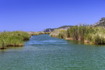 The Dalyan River with tourist boats in the straits of the river 