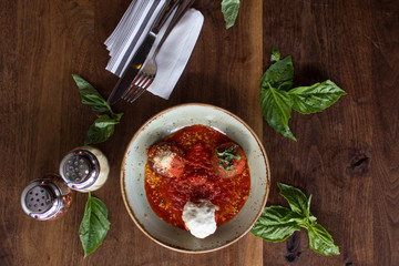 Meatball sampling with burrata mozzarella, fresh basil, and crushed red pepper