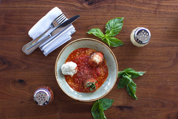Meatball sampling with burrata mozzarella, fresh basil, and crushed red pepper