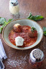Meatball sampling with burrata mozzarella, fresh basil, and crushed red pepper