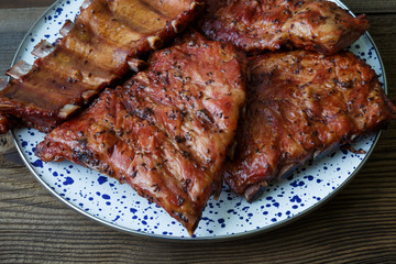 Grilled pork ribs on a wooden old board