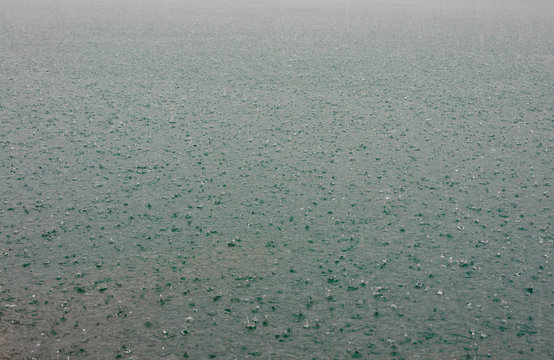 Surface of water in rain drops at Chieou Laan lake