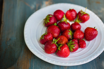 Ripe strawberries in a plate