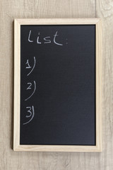 Space chalkboard background texture with wooden frame for notes and lists. blackboard space for wallpaper. Landscape mounting style vertical.
