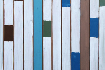 Texture of vertical multicolored decorative planks