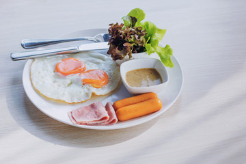 English breakfast  egg, bacon and vegetables on wood background