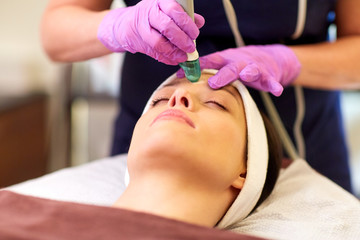 Obraz na płótnie Canvas woman having microdermabrasion facial treatment