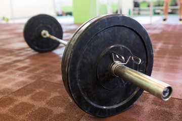 Obraz na płótnie Canvas barbell on floor in gym