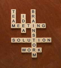 Crossword puzzle with words Team, Brainstorm, Solution, Idea. Problem solving concept.