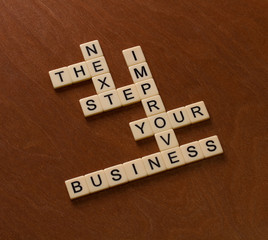 Crossword puzzle with words Next, Step, Business. Start Up concept.