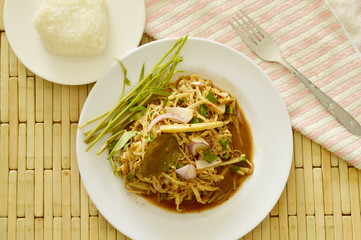 spicy shredded bamboo shoot salad in Thai northeastern style eat with sticky rice