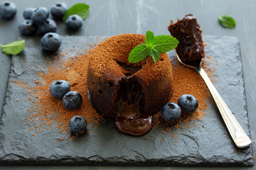 Fondant- delicious chocolate dessert with blueberries.