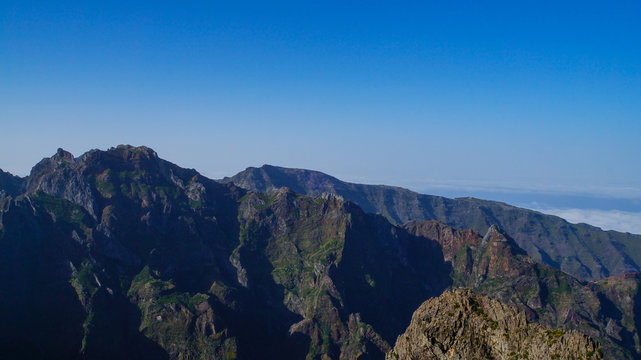 Madeira - Pico do Arieiro mountains with green rocks and clouds beneath © Simon