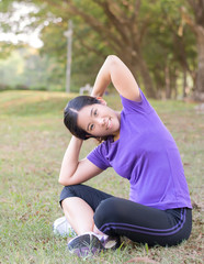Asia woman warm up her body before exercise