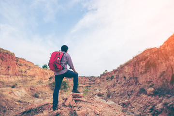 Fototapeta premium Hiking man rock climbing and winner action