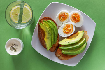 Open sandwiches with avocado and eggs