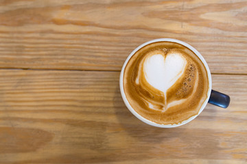 Coffee cup of Cafe' latte with heart latte art on top, top view picture