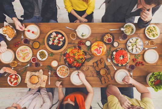 People eat healthy meals at served table dinner party