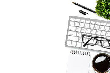 Computer keyboard, coffee and office supplies are isolated on white background. Top view with copy space, flat lay.