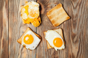 toast and egg on wooden table
