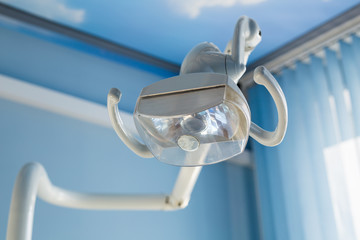 Dental health care concept background - Dental handle lamp close up. Dentistry and stomatology equipment