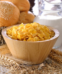 corn flakes in wood bowl