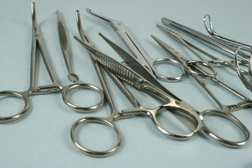 Medical surgical Instruments on blue background.