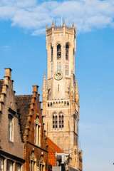 The Belfry Tower, aka Belfort, of Bruges, medieval bell tower in the historical centre of Bruges, Belgium. Close-up view of the top.