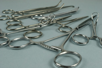 Medical surgical Instruments on blue background.