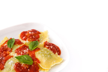 Ravioli with tomato sauce and basil isolated on white background

