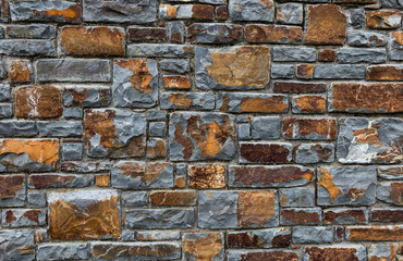 orange, brown and grey stone wall design background texture