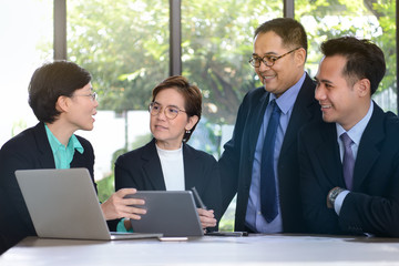 Group of business people discussing and working together during a meeting in office