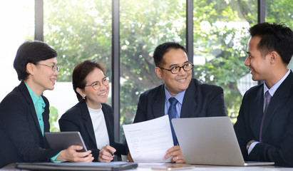 Group of business people discussing and working together during a meeting in office