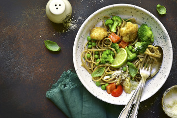 Wholewheat organic pasta with vegetables.Top view with copy space.