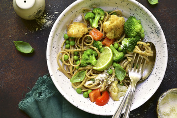Wholewheat organic pasta with vegetables.Top view.
