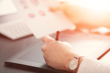 Male hands using graphics tablet