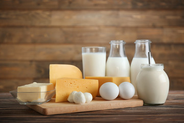 Different dairy products on wooden table