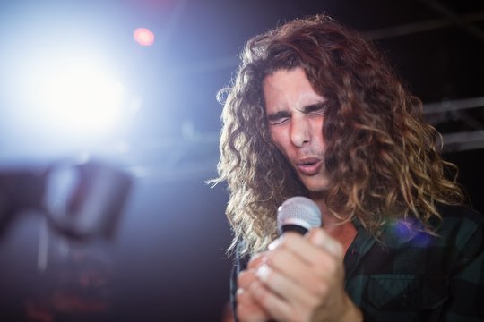 Young Male Singer Performing At Nightclub