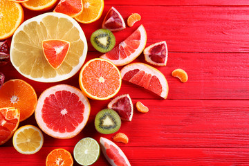 Beautiful composition with citrus fruits on wooden background