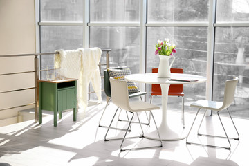 Modern living room with table and chairs